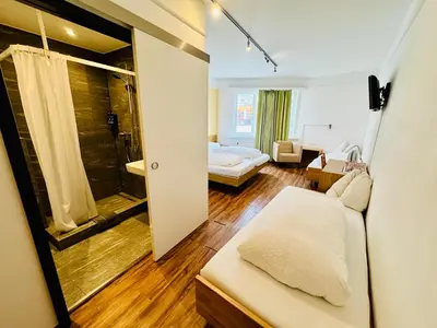 Ein Bett oder Betten in einem Zimmer der Unterkunft Hotel Toscana