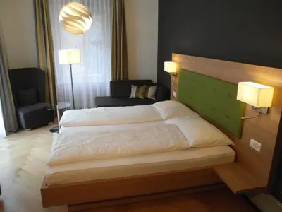 Ein Bett oder Betten in einem Zimmer der Unterkunft Waldhotel Unspunnen