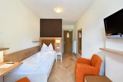 Ein Bett oder Betten in einem Zimmer der Unterkunft Waldhotel Unspunnen