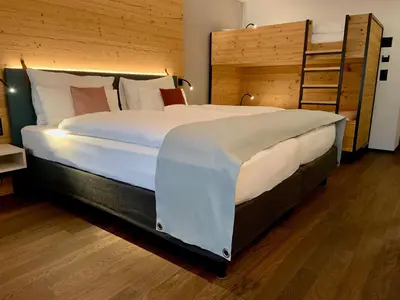 Ein Bett oder Betten in einem Zimmer der Unterkunft Hotel Interlaken