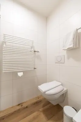 Ein Badezimmer in der Unterkunft Hotel Bernerhof Grindelwald