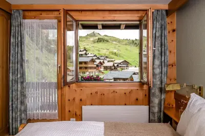 Ein Bett oder Betten in einem Zimmer der Unterkunft Hotel Alpfrieden