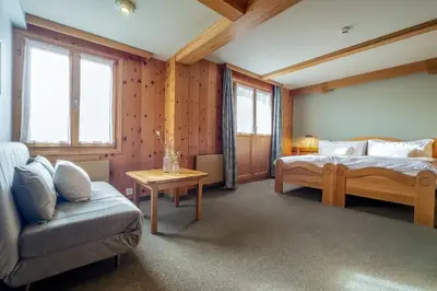 Ein Bett oder Betten in einem Zimmer der Unterkunft Hotel Alpfrieden