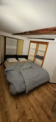 Ein Bett oder Betten in einem Zimmer der Unterkunft Airolo with private parking
