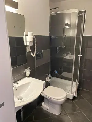 Ein Badezimmer in der Unterkunft Hotel Europe Brig