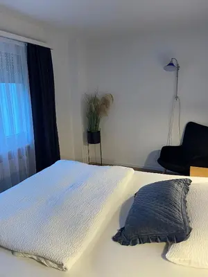 Ein Bett oder Betten in einem Zimmer der Unterkunft Hotel Europe Brig