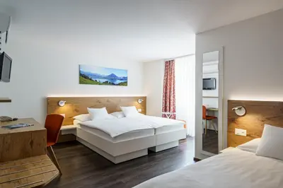 Ein Bett oder Betten in einem Zimmer der Unterkunft Hotel Bernerhof