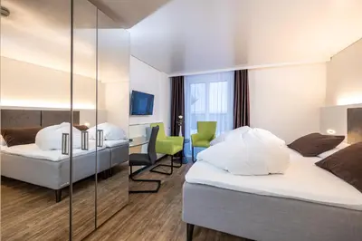 Ein Bett oder Betten in einem Zimmer der Unterkunft Hotel Rischli