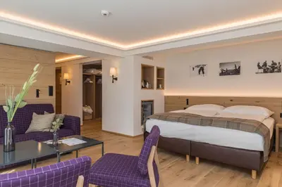 Ein Bett oder Betten in einem Zimmer der Unterkunft Hotel Bella Vista Zermatt
