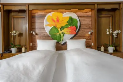 Ein Bett oder Betten in einem Zimmer der Unterkunft dala Hotel & Apartments