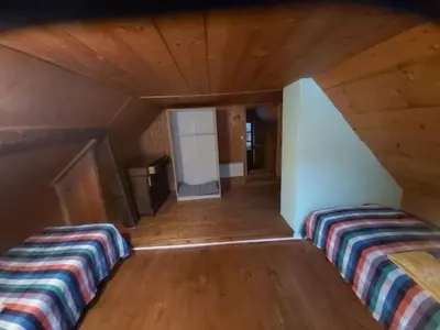 Ein Bett oder Betten in einem Zimmer der Unterkunft Tepilanti