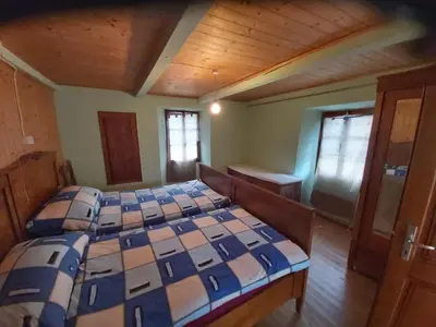 Ein Bett oder Betten in einem Zimmer der Unterkunft Tepilanti