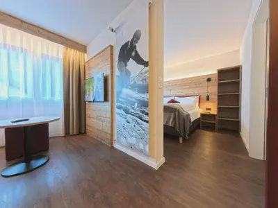 Ein Bett oder Betten in einem Zimmer der Unterkunft Therme 51° Hotel Physio & Spa