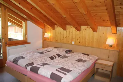 Ein Bett oder Betten in einem Zimmer der Unterkunft Haus Pan