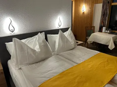 Ein Bett oder Betten in einem Zimmer der Unterkunft Post Hotel Vista