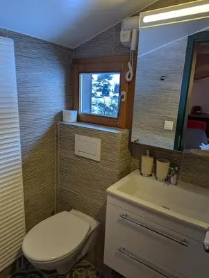 Ein Badezimmer in der Unterkunft Hotel Schützen Lauterbrunnen