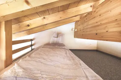 Ein Bett oder Betten in einem Zimmer der Unterkunft Hotel Alpina