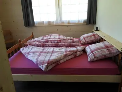 Ein Bett oder Betten in einem Zimmer der Unterkunft Ferien in der Bergwelt von Adelboden