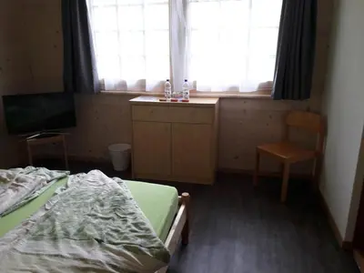 Ein Bett oder Betten in einem Zimmer der Unterkunft Ferien in der Bergwelt von Adelboden