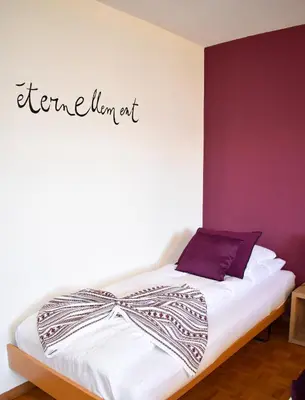 Ein Bett oder Betten in einem Zimmer der Unterkunft Hostellerie d'Orzival