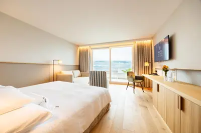 Ein Bett oder Betten in einem Zimmer der Unterkunft BEATUS Wellness- & Spa-Hotel