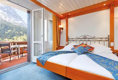 Ein Bett oder Betten in einem Zimmer der Unterkunft Derby Swiss Quality Hotel