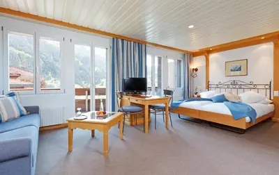 Ein Bett oder Betten in einem Zimmer der Unterkunft Derby Swiss Quality Hotel