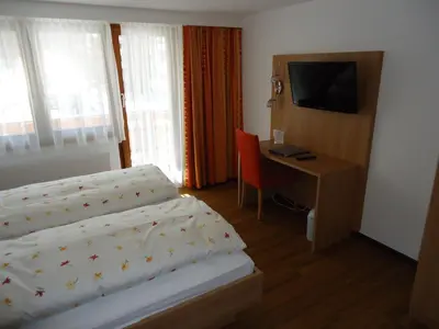 Ein Bett oder Betten in einem Zimmer der Unterkunft Hotel Monte-Moro