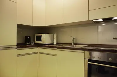 Küche/Küchenzeile in der Unterkunft Apartment Enzian mit Mitbenutzung SPA & Wellness - GRIWA RENT AG