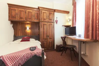 Ein Bett oder Betten in einem Zimmer der Unterkunft Le Petit CHARME-INN