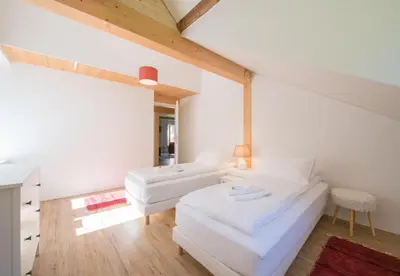 Ein Bett oder Betten in einem Zimmer der Unterkunft Le Manoir Penthouse