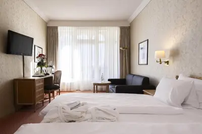Ein Bett oder Betten in einem Zimmer der Unterkunft Grand Hotel Beau Rivage Interlaken