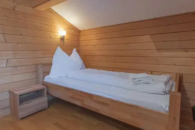 Ein Bett oder Betten in einem Zimmer der Unterkunft Berghaus Niederhorn