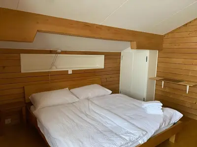 Ein Bett oder Betten in einem Zimmer der Unterkunft Berghaus Niederhorn