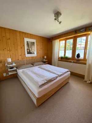 Ein Bett oder Betten in einem Zimmer der Unterkunft Ferienwohnung Résidence Sonnegg - Hein