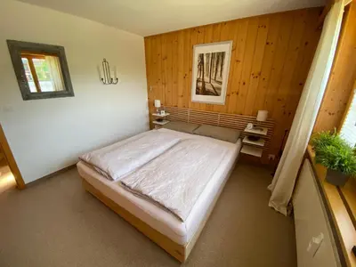 Ein Bett oder Betten in einem Zimmer der Unterkunft Ferienwohnung Résidence Sonnegg - Hein