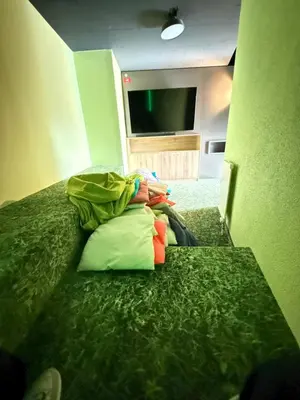 Ein Bett oder Betten in einem Zimmer der Unterkunft Wohnung mit See und Bergsicht im vier Sterne Hotel