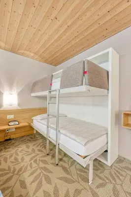 Ein Bett oder Betten in einem Zimmer der Unterkunft Hotel Simi