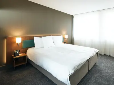Ein Bett oder Betten in einem Zimmer der Unterkunft Belvédère Strandhotel