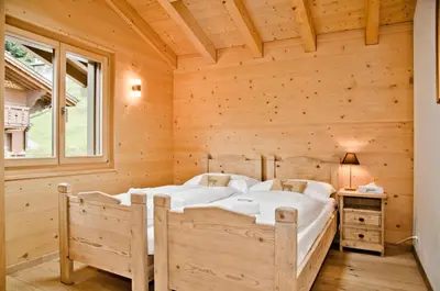 Ein Bett oder Betten in einem Zimmer der Unterkunft Apartment Bäreggblick - GRIWA RENT AG