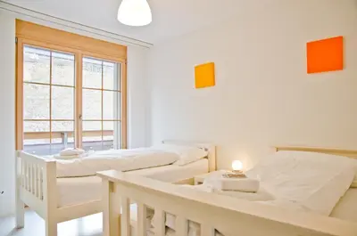 Ein Bett oder Betten in einem Zimmer der Unterkunft Apartment Alpha - GRIWA RENT AG