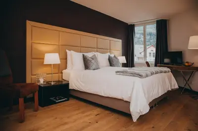Ein Bett oder Betten in einem Zimmer der Unterkunft Hotel Dakota