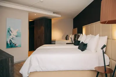 Ein Bett oder Betten in einem Zimmer der Unterkunft Hotel Dakota