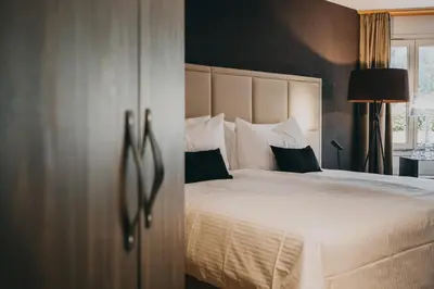 Ein Bett oder Betten in einem Zimmer der Unterkunft Hotel Dakota
