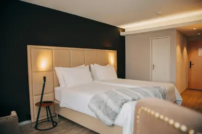 Ein Bett oder Betten in einem Zimmer der Unterkunft Hotel Dakota