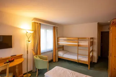Ein Bett oder Betten in einem Zimmer der Unterkunft Genusshotel Brienz