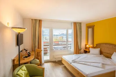 Ein Bett oder Betten in einem Zimmer der Unterkunft Genusshotel Brienz