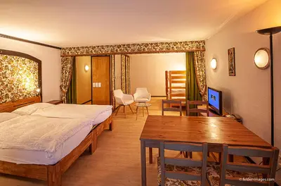 Ein Bett oder Betten in einem Zimmer der Unterkunft Hotel Astoria