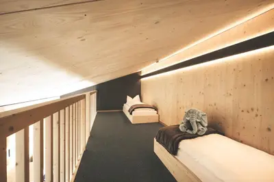 Ein Bett oder Betten in einem Zimmer der Unterkunft Frutigresort