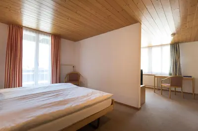 Ein Bett oder Betten in einem Zimmer der Unterkunft Blümlisalp